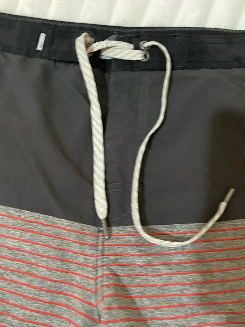 Vuori Men's Swim Shorts in Black with Dusty Rose Accent